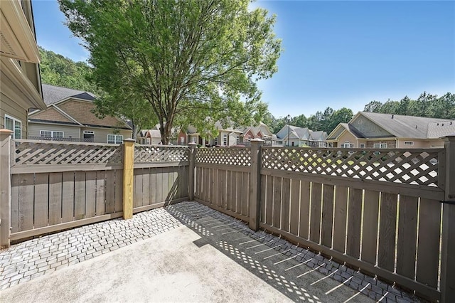 223 Glens Loop, Woodstock, GA 30188 - fenced backyard with a patio and a residential view
