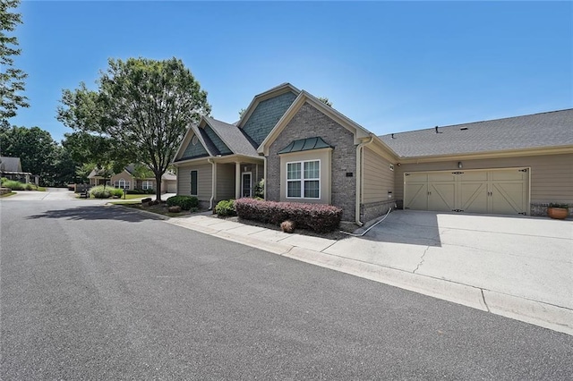223 Glens Loop, Woodstock, GA 30188 - craftsman-style house with an attached garage, driveway, and brick siding