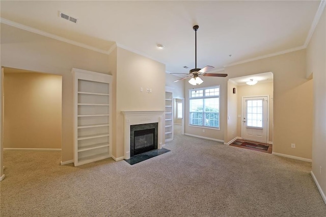 223 Glens Loop, Woodstock, GA 30188 - unfurnished living room with a high end fireplace, carpet, baseboards, a ceiling fan, and crown molding