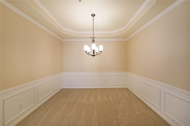 223 Glens Loop, Woodstock, GA 30188 - empty room featuring a tray ceiling, a chandelier, wainscoting, light colored carpet, and crown molding