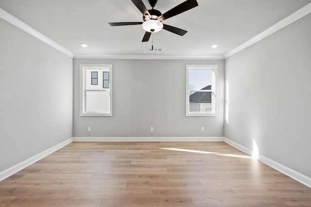 empty room with ceiling fan, ornamental molding, and light hardwood / wood-style flooring