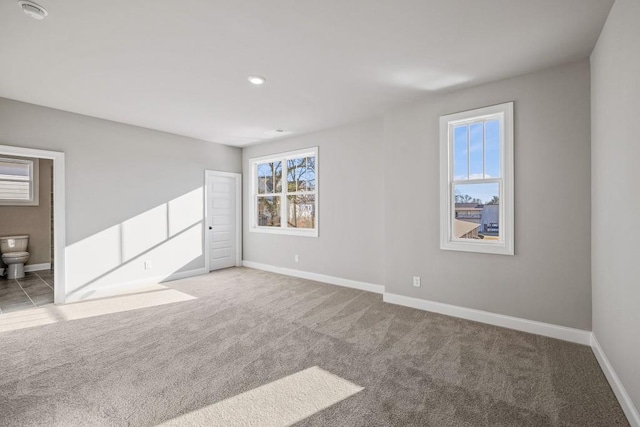 empty room featuring carpet flooring