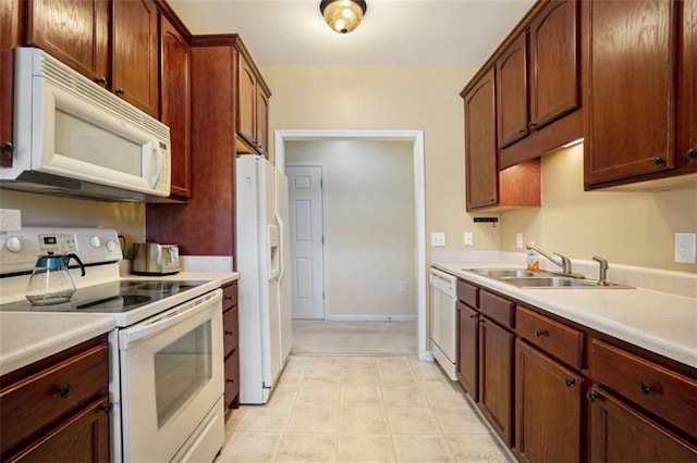 kitchen with sink and white appliances