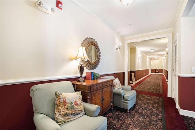 living area featuring crown molding and dark carpet