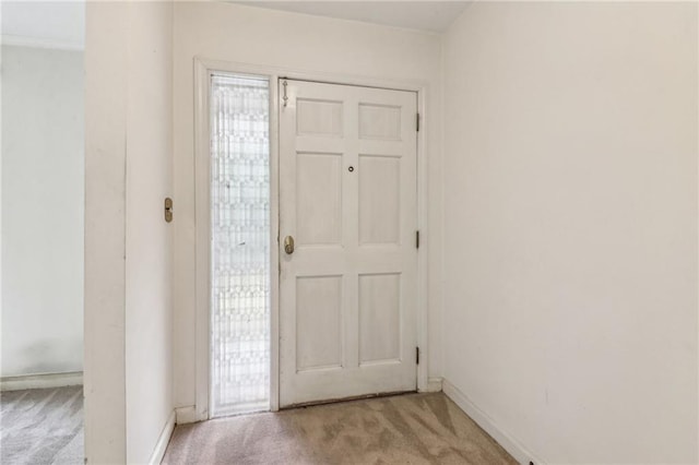 foyer with light carpet