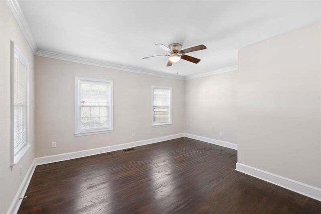 spare room with dark hardwood / wood-style floors, ceiling fan, and ornamental molding