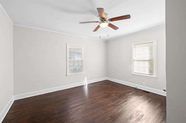 unfurnished room with ceiling fan, dark hardwood / wood-style floors, and ornamental molding