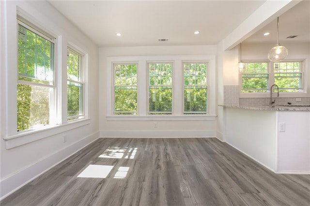 interior space featuring a healthy amount of sunlight and sink