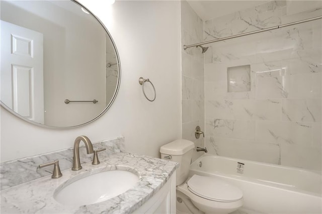 full bathroom with vanity, toilet, and tiled shower / bath