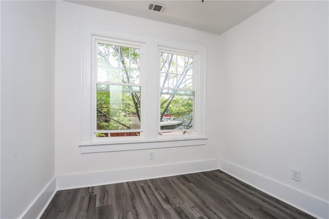 empty room featuring dark hardwood / wood-style floors