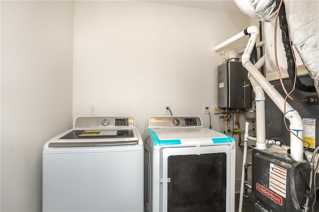 clothes washing area with washer and dryer