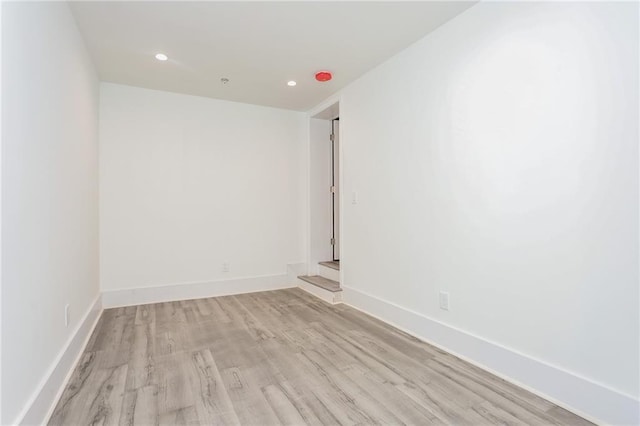 unfurnished room with light hardwood / wood-style flooring