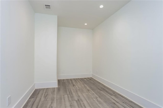 spare room with light hardwood / wood-style flooring