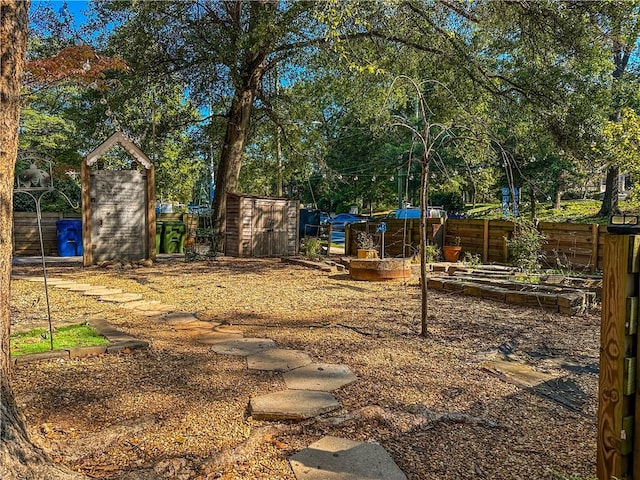 view of yard with a storage unit