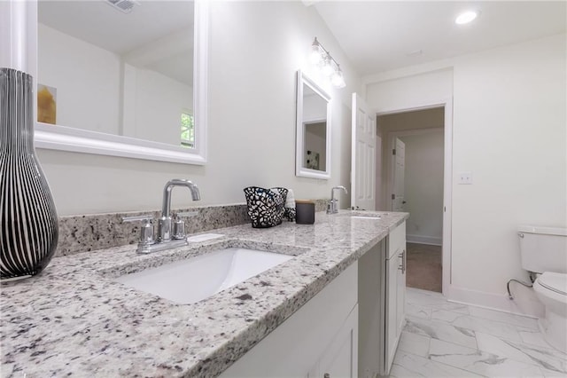 full bath with a sink, baseboards, toilet, and marble finish floor
