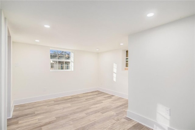 unfurnished room featuring recessed lighting, baseboards, and light wood-style floors