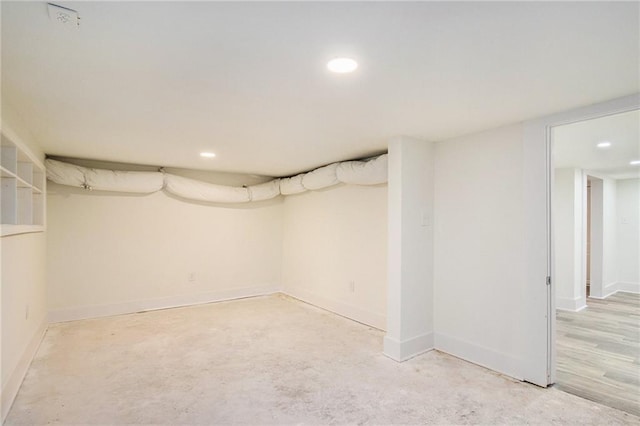finished basement with recessed lighting and baseboards