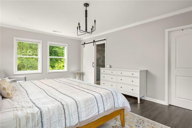 bedroom featuring visible vents, ornamental molding, baseboards, dark wood-style floors, and a barn door