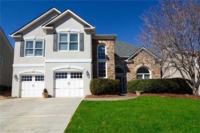 traditional home featuring a front yard, driveway, an attached garage, stucco siding, and stone siding