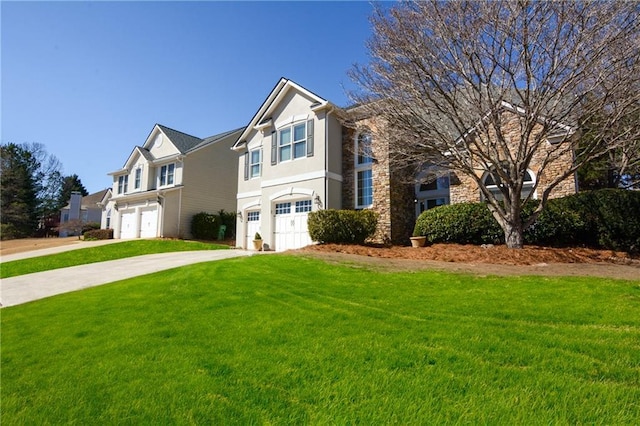 traditional-style house featuring a front yard, stucco siding, driveway, stone siding, and an attached garage