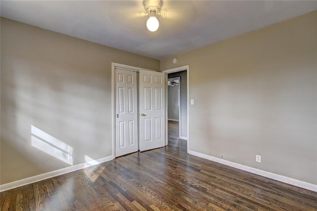 spare room with dark hardwood / wood-style floors