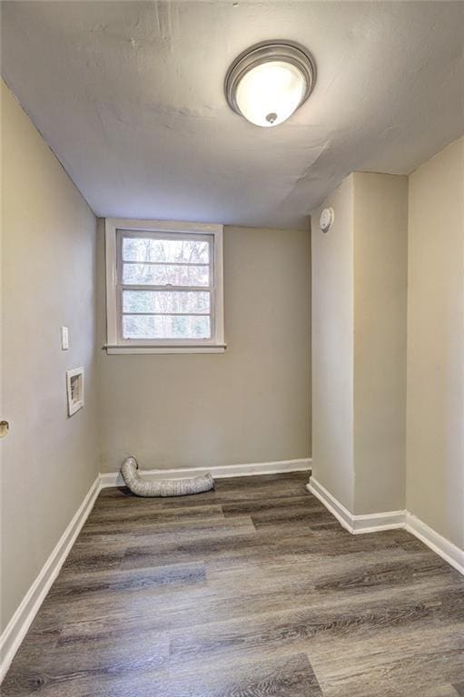 spare room featuring dark wood-type flooring