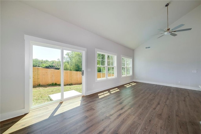 unfurnished living room featuring visible vents, baseboards, a ceiling fan, dark wood finished floors, and high vaulted ceiling