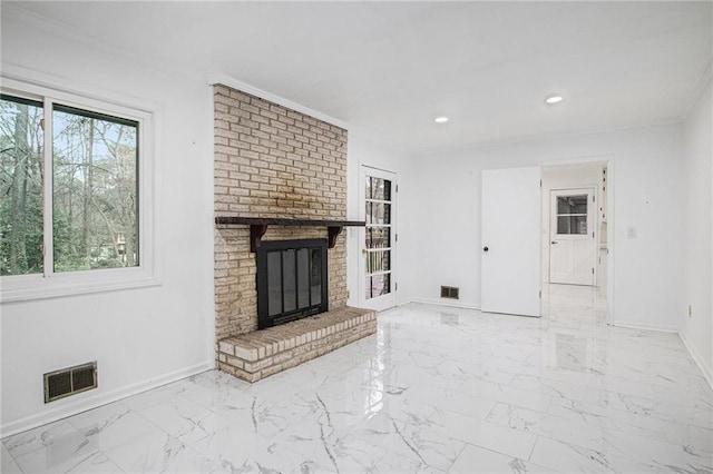 living area with a brick fireplace, baseboards, visible vents, and marble finish floor