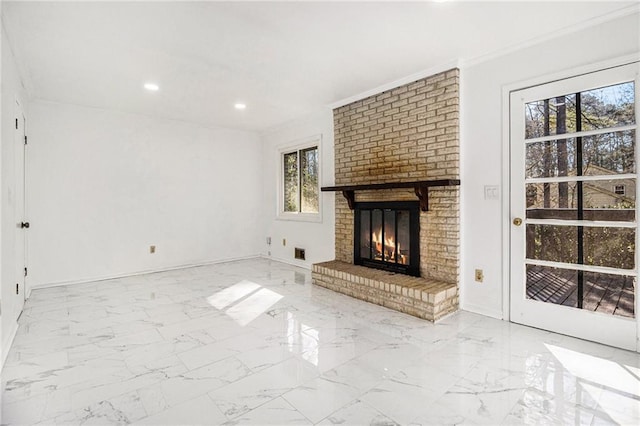 unfurnished living room with recessed lighting, marble finish floor, a brick fireplace, and ornamental molding