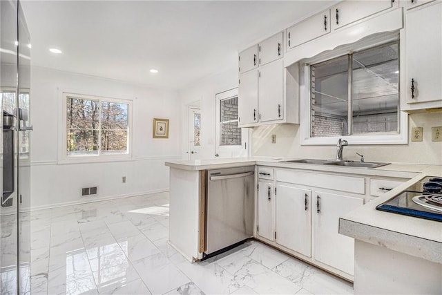 kitchen featuring visible vents, marble finish floor, a sink, stainless steel dishwasher, and light countertops