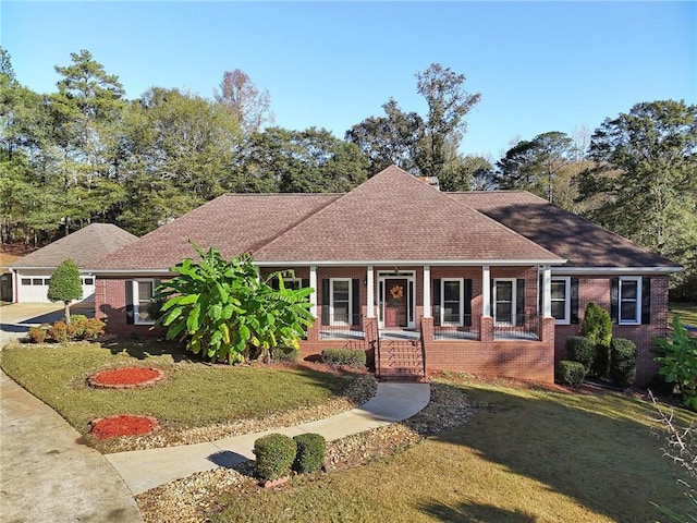 view of front of property with covered porch and a front yard