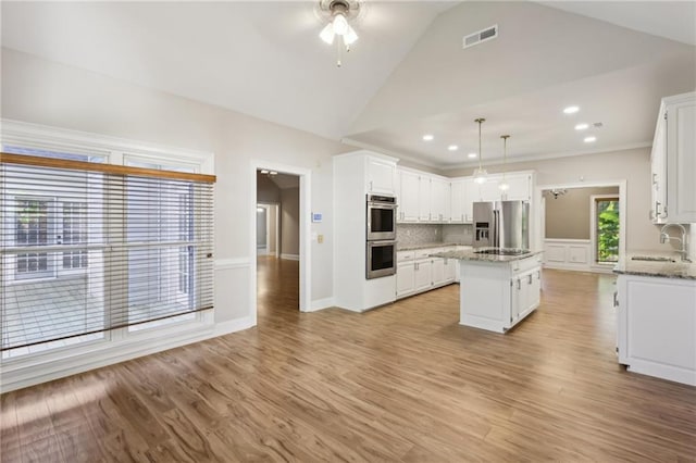 unfurnished sunroom with ceiling fan and lofted ceiling