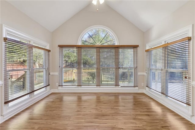 bedroom with access to exterior, light carpet, ensuite bath, ceiling fan, and a barn door