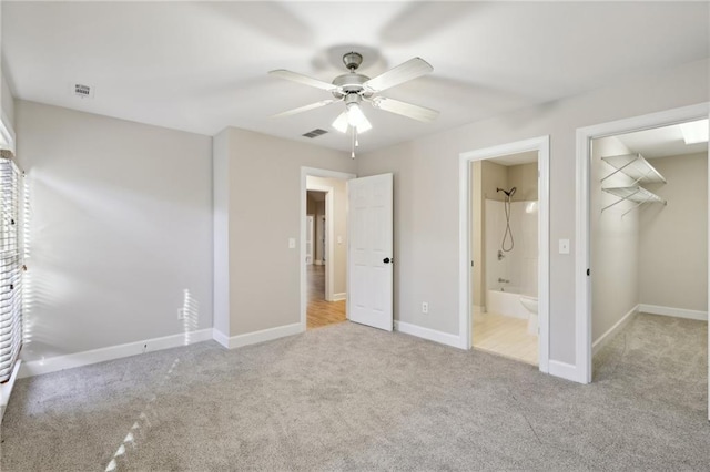 walk in closet featuring carpet floors