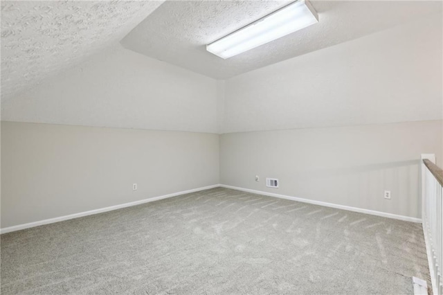 unfurnished room with a drop ceiling and light wood-type flooring