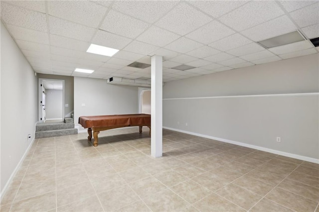 basement with tile patterned floors, a drop ceiling, and billiards