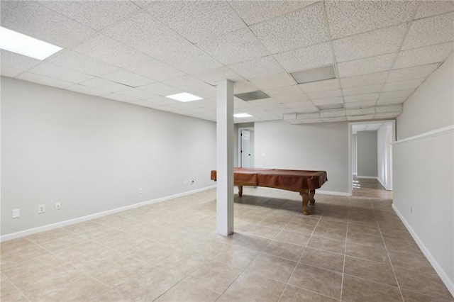 unfurnished room with light carpet and a paneled ceiling