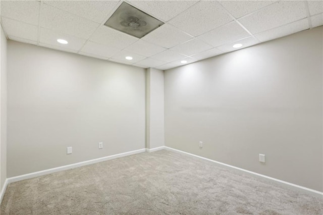 walk in closet with carpet flooring and a drop ceiling