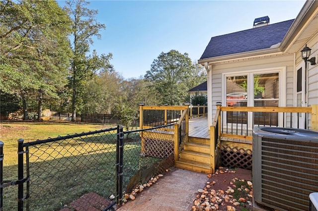 back of property featuring a yard and a deck