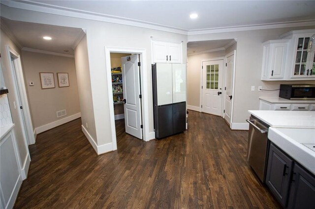 200 Carney Ct, Ball Ground, GA 30107 - kitchen with crown molding, visible vents, light countertops, white cabinetry, and appliances with stainless steel finishes