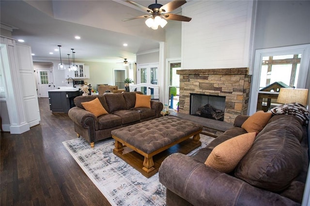 200 Carney Ct, Ball Ground, GA 30107 - living area featuring crown molding, dark wood-style flooring, a stone fireplace, ceiling fan, and recessed lighting