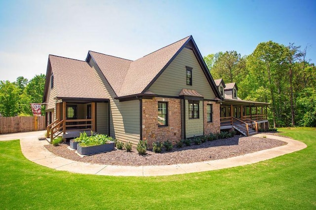 200 Carney Ct, Ball Ground, GA 30107 - view of side of property with fence, stone siding, roof with shingles, a lawn, and a porch