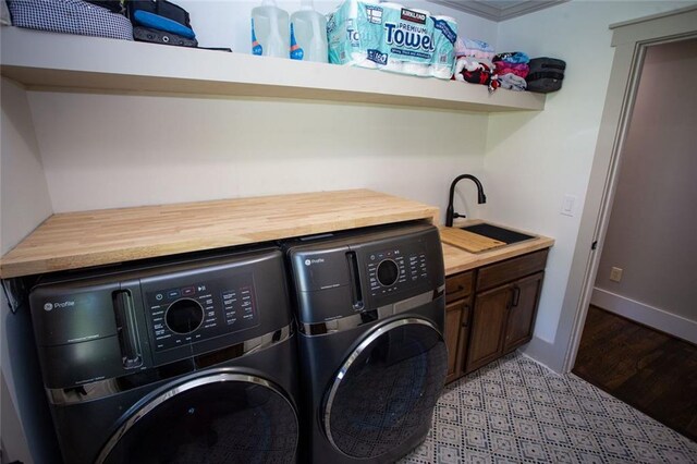 200 Carney Ct, Ball Ground, GA 30107 - clothes washing area with baseboards, a sink, cabinet space, and independent washer and dryer
