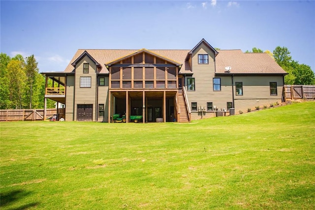 200 Carney Ct, Ball Ground, GA 30107 - back of property with fence, a yard, a sunroom, and stairway