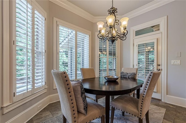 dining area featuring an inviting chandelier, ornamental molding, and a wealth of natural light