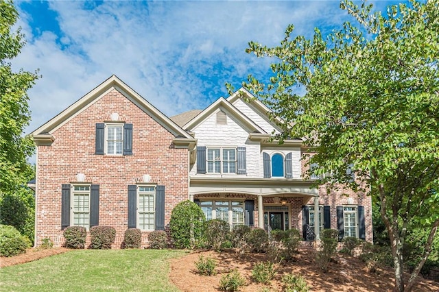 view of front of home with a front lawn