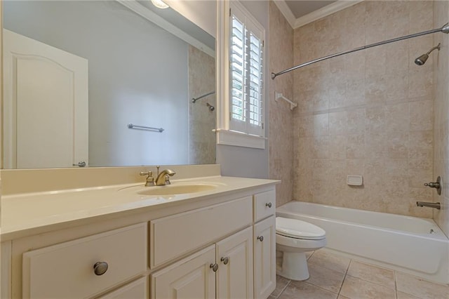 full bathroom featuring tiled shower / bath, vanity, ornamental molding, toilet, and tile patterned floors