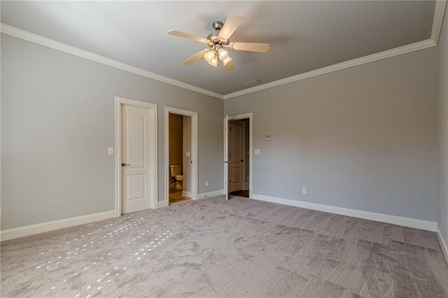 carpeted empty room featuring crown molding and ceiling fan