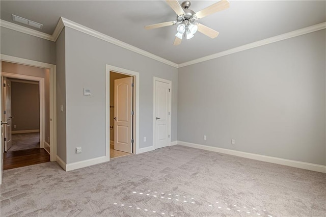 unfurnished bedroom featuring light carpet, crown molding, and ceiling fan