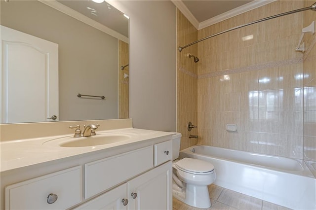 full bathroom featuring tile patterned flooring, ornamental molding, tiled shower / bath combo, vanity, and toilet